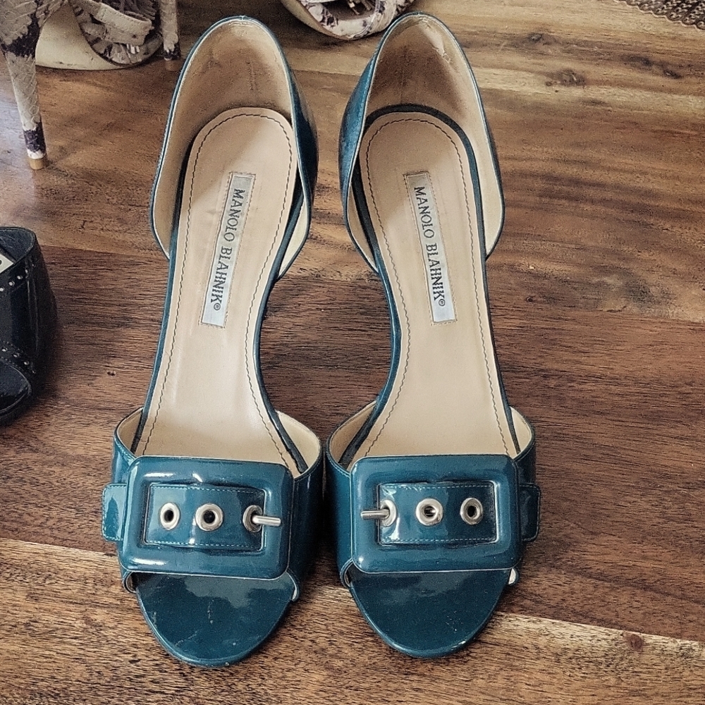 Open toe heels with a buckle. Cute.